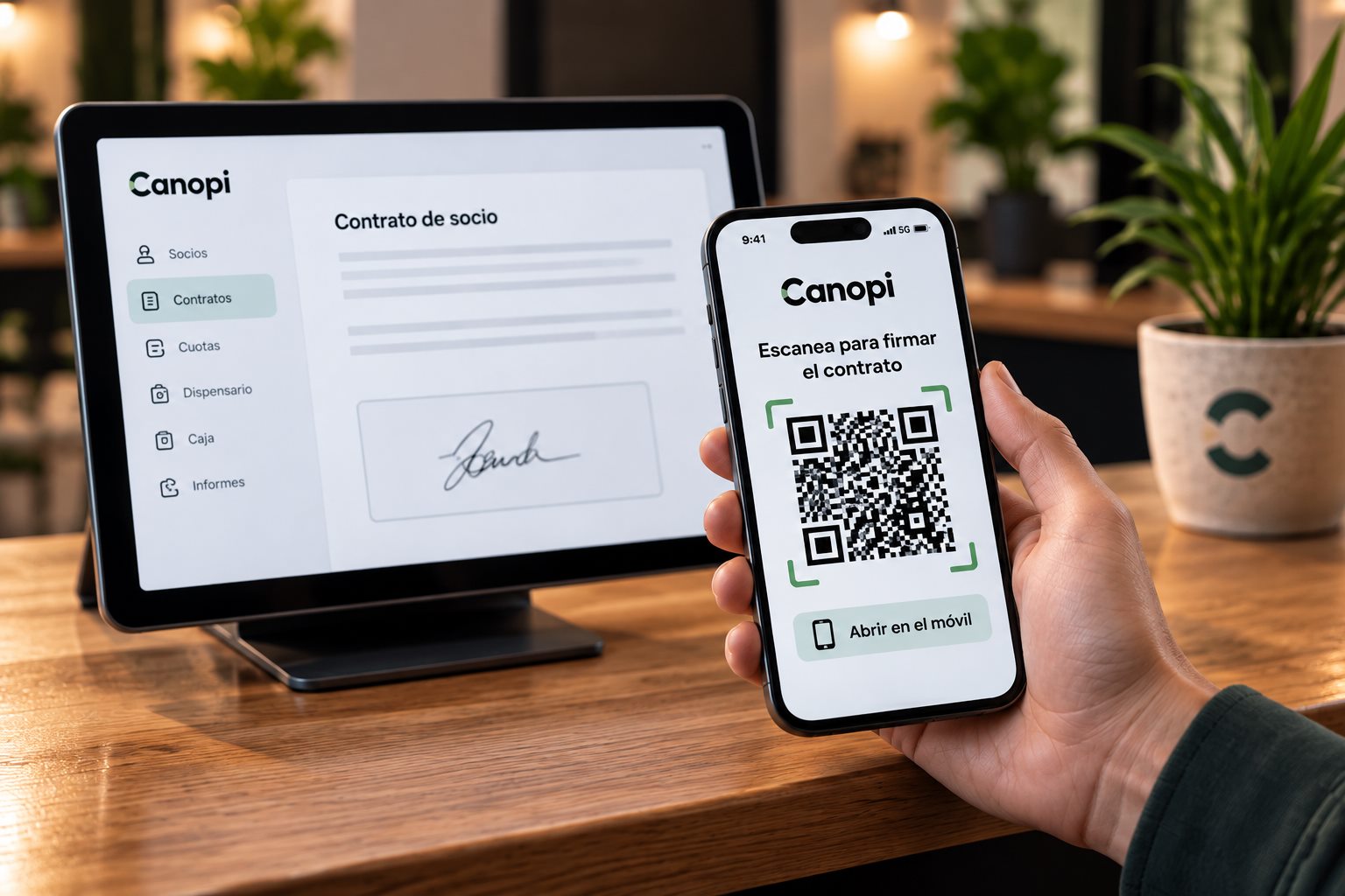 Tablet showing a signed membership contract in Canopi and a phone with the QR code to sign the contract